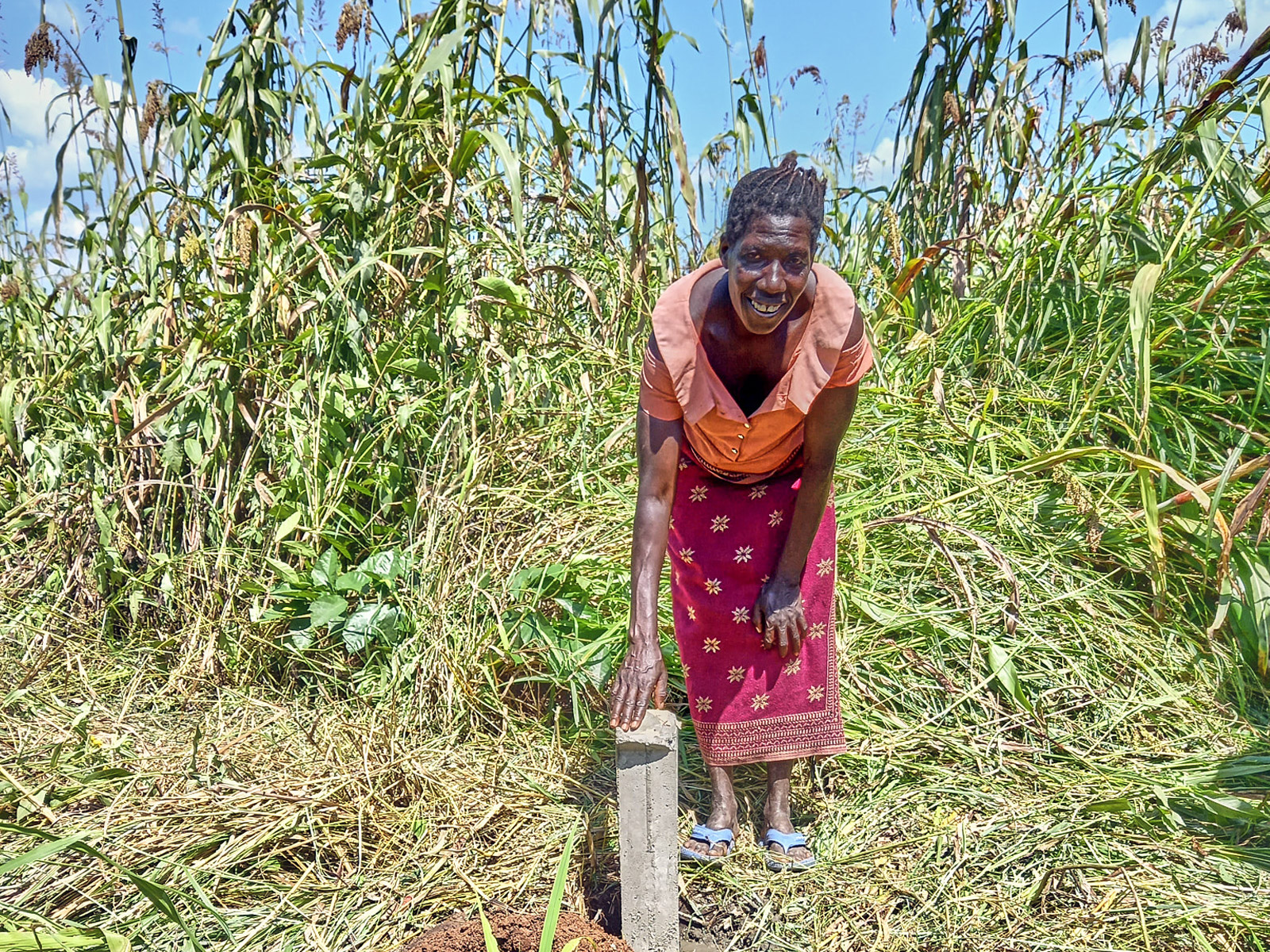 Sylvia stands by a boundary marker.